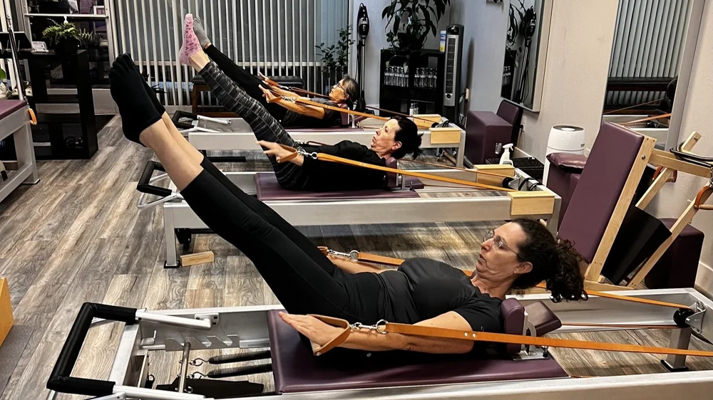 Students working on the reformers in a small MOVE class