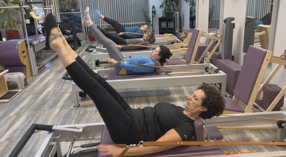 Students on the reformers during a MOVE class at Body Evolutions